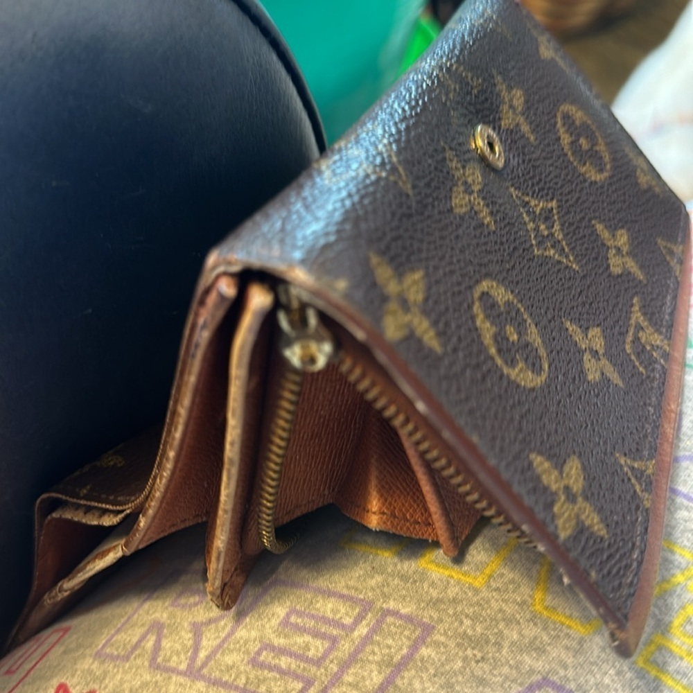 Louis Vuitton billfold. The dimensions are 6 inches wide and 4 inches. Authentic - Picture 7 of 10